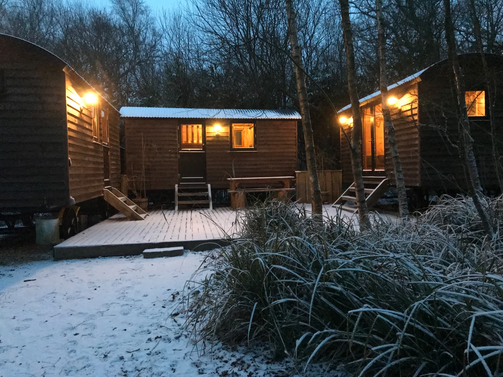 Shepherd's huts in the snow at dusk