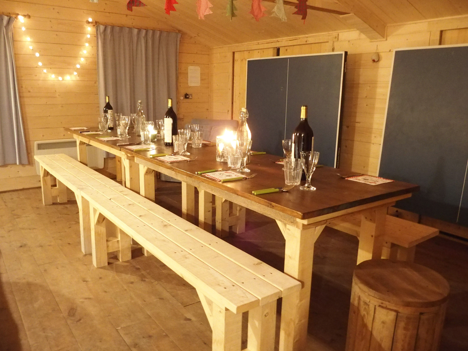The Den laid out for a group dinner, with the table tennis folded away against the wall